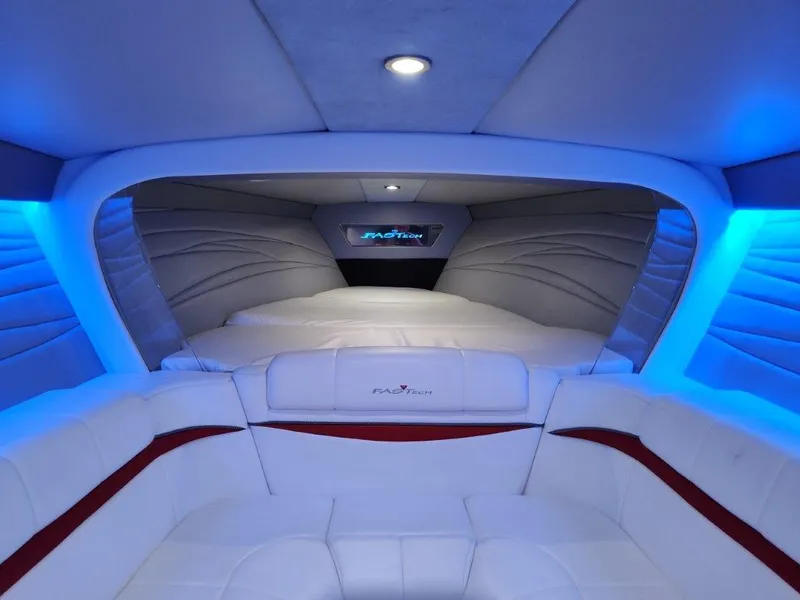 Slide: The Image of 2015 Formula 382 FASTech cabin with blue ambient lighting and white seating. - 19