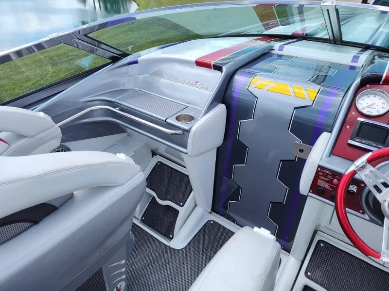 Slide: The Image of 2015 Formula 382 FASTech boat interior with modern dashboard and sleek design. - 7