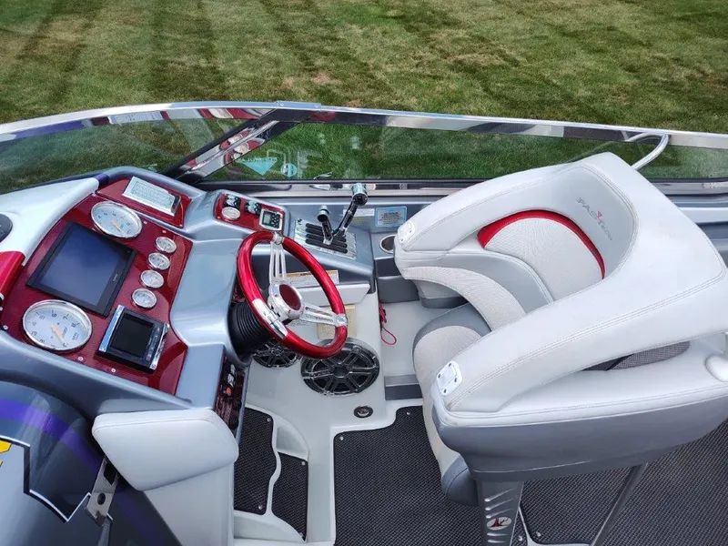 Slide: The Image of Cockpit of 2015 Formula 382 FASTech boat with red accents and modern controls. - 9