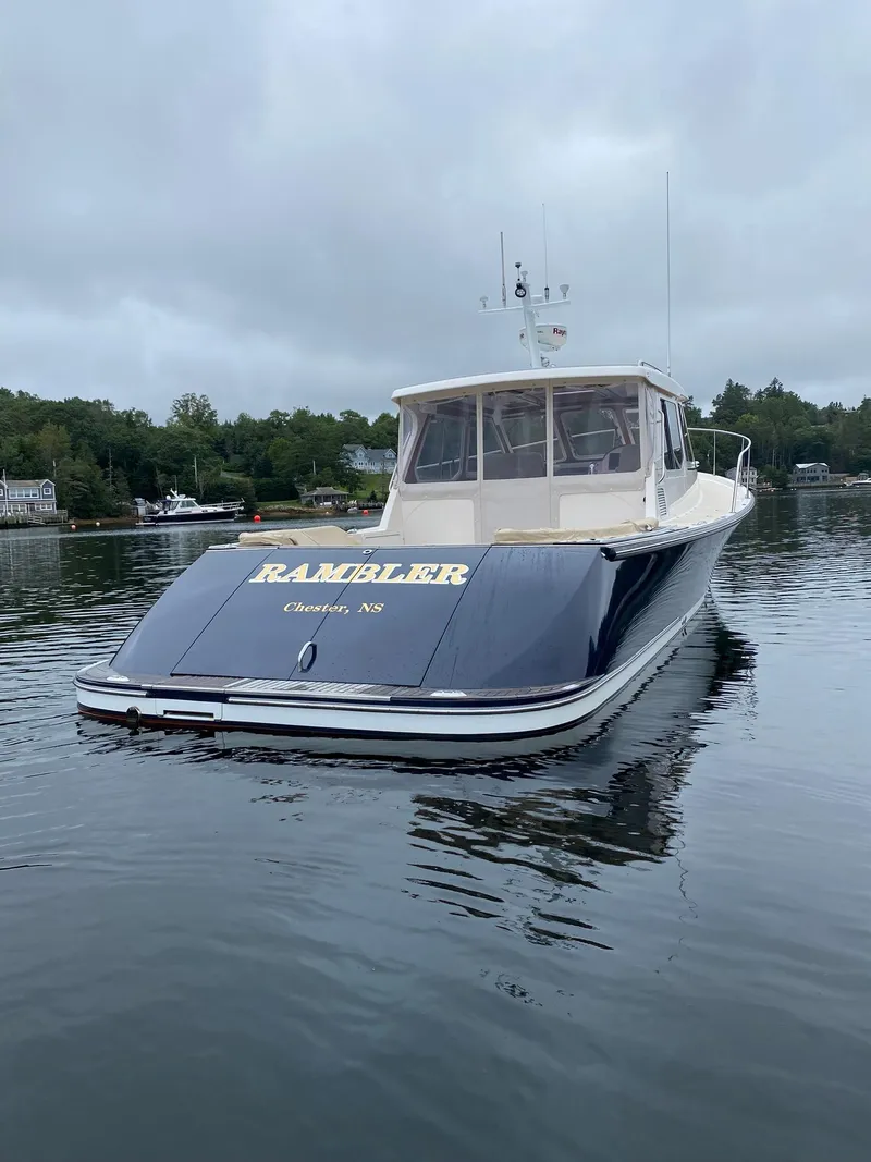 Slide: The Image of Pearson 38 True North 2010 boat on calm water, overcast sky. - 32