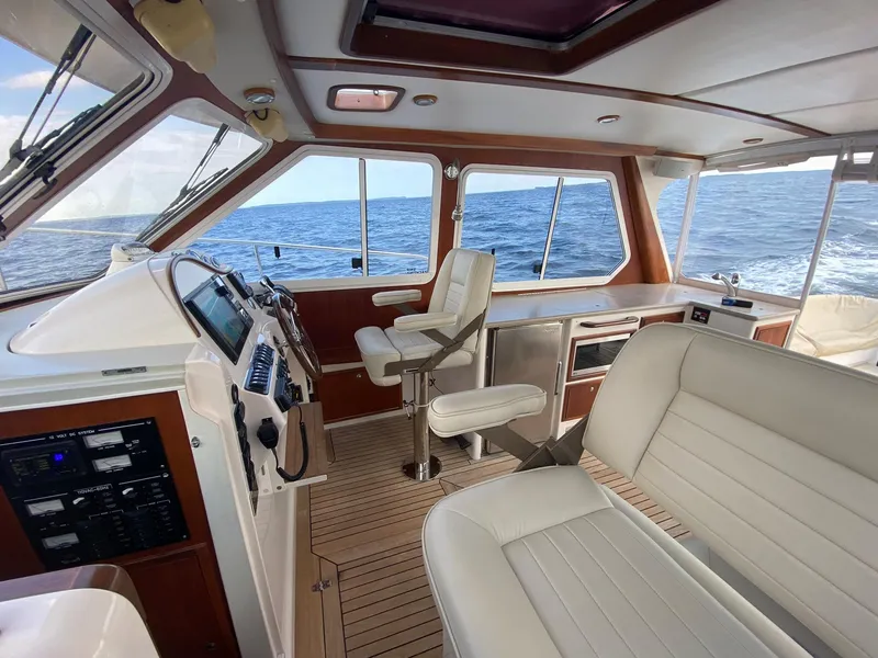 Slide: The Image of Interior of 2010 Pearson 38 True North yacht with ocean view and modern helm. - 7