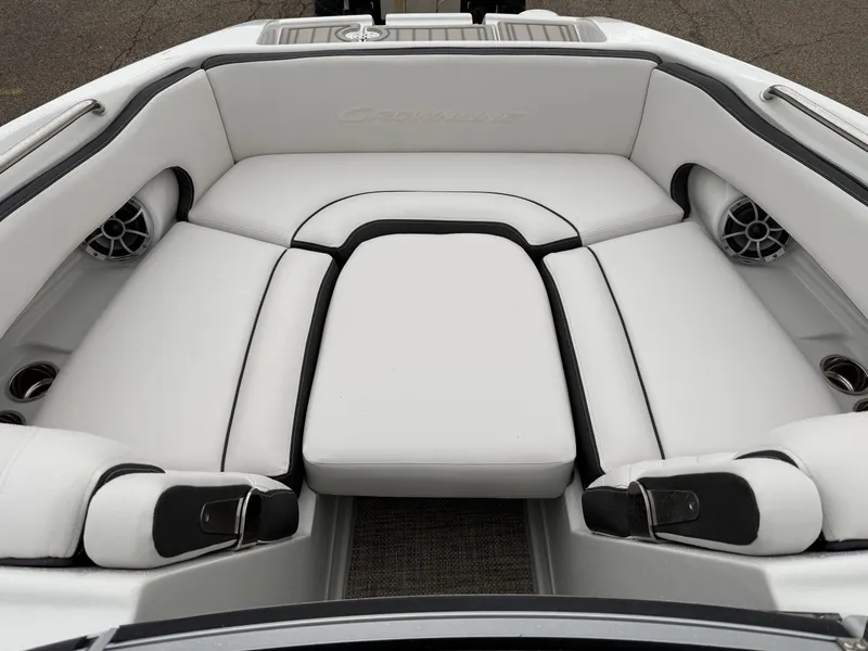 Slide: The Image of 2024 Crownline Eclipse E240 XS boat interior with white cushioned seating. - 4