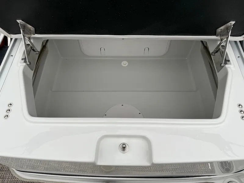 Slide: The Image of Open storage compartment in 2024 Crownline Eclipse E240 XS boat. - 6