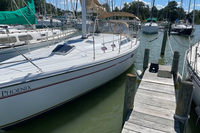 The Image of Sailboat Catalina 36 MkII, 1995 model, docked at a marina with clear skies. - 0