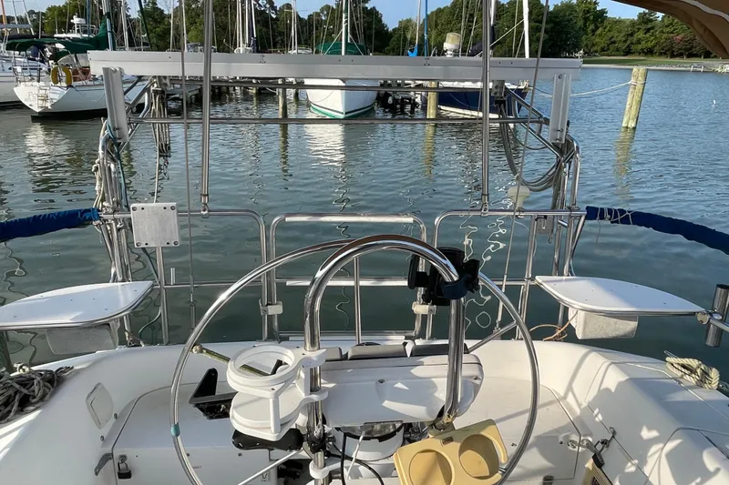 Slide: The Image of Cockpit view of a 1995 Catalina 36 MkII sailboat docked at a marina. - 10