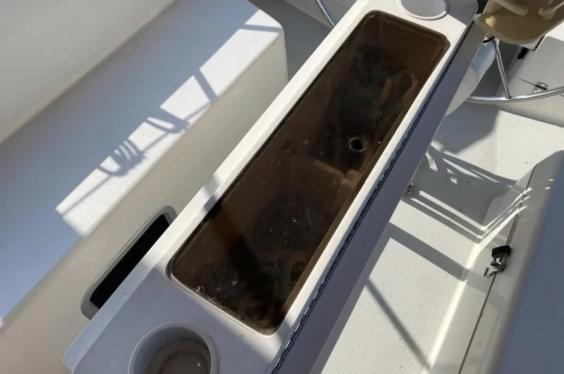 Slide: The Image of Cockpit view of 1995 Catalina 36 MkII sailboat with storage compartment. - 11