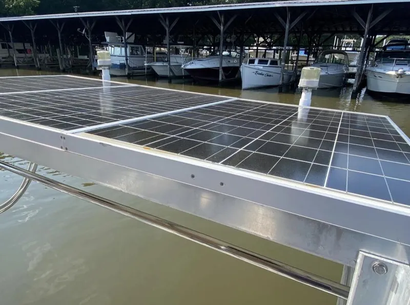 Slide: The Image of Solar panels on a docked 1995 Catalina 36 MkII sailboat in a marina. - 12