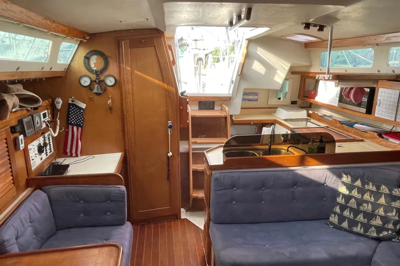 Slide: The Image of Interior of a 1995 Catalina 36 MkII sailboat with cozy seating and nautical decor. - 40