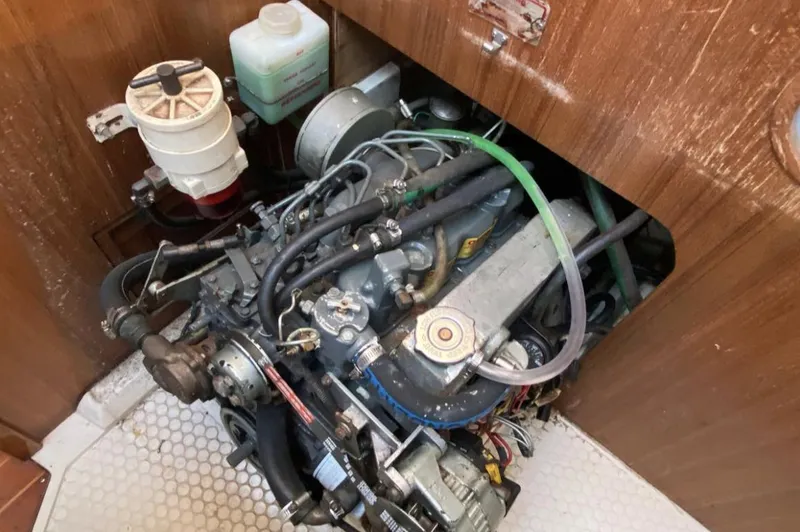 Slide: The Image of Engine compartment of a 1995 Catalina 36 MkII sailboat, showing detailed mechanical components. - 42