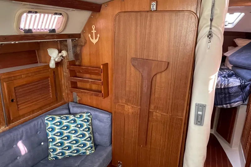 Slide: The Image of Interior of 1995 Catalina 36 MkII sailboat with wooden paneling and cozy seating area. - 45