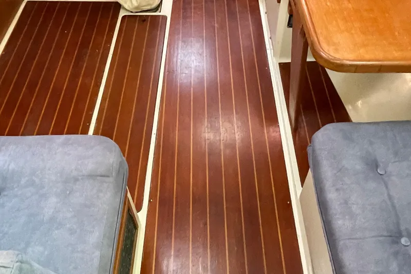 Slide: The Image of Interior of 1995 Catalina 36 MkII sailboat with wooden flooring and cushioned seating. - 51