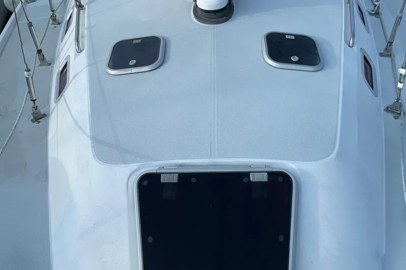 Slide: The Image of Deck view of a 1995 Catalina 36 MkII sailboat, featuring hatches and rigging. - 8