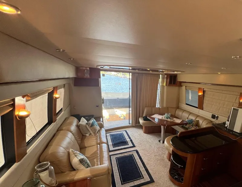 Slide: The Image of Luxurious interior of 2006 Carver Voyager Sky Lounge yacht with elegant seating and decor. - 11