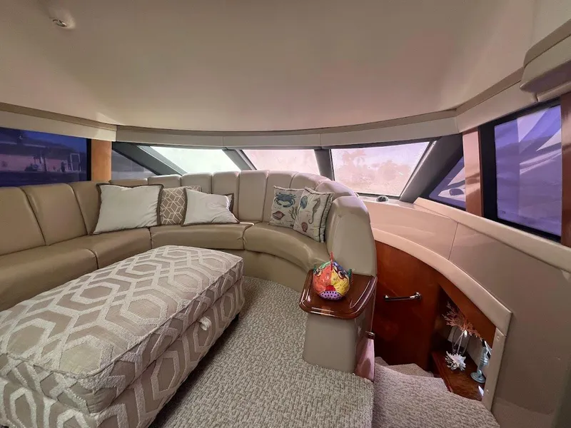 Slide: The Image of Luxurious interior of a 2006 Carver Voyager Sky Lounge with plush seating and panoramic windows. - 12