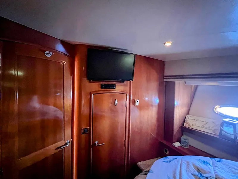 Slide: The Image of Interior of 2006 Carver Voyager Sky Lounge with wood paneling and mounted TV. - 27