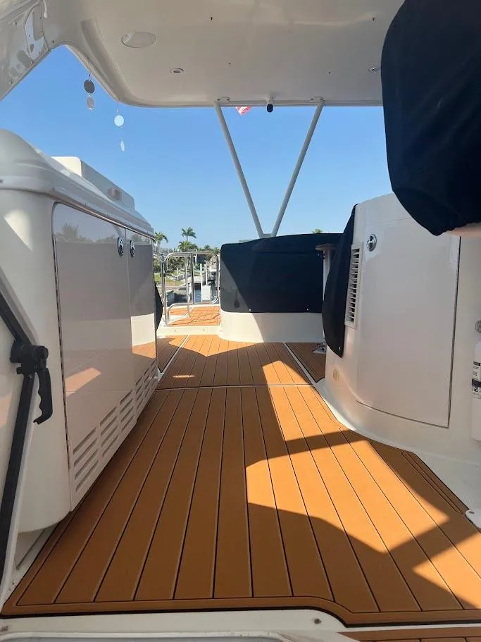 Slide: The Image of 2006 Carver Voyager boat interior with teak flooring and modern design elements. - 32