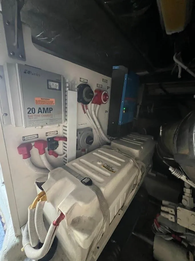 Slide: The Image of 2006 Carver Voyager engine room with battery charger and electrical components. - 39