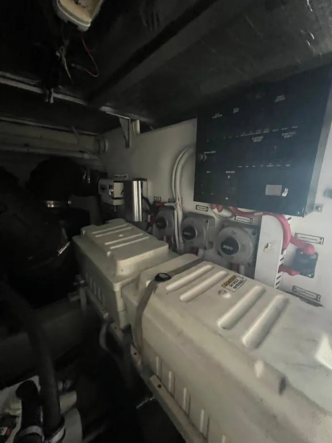 Slide: The Image of Engine room of a 2006 Carver Voyager boat, featuring control panel and machinery. - 40