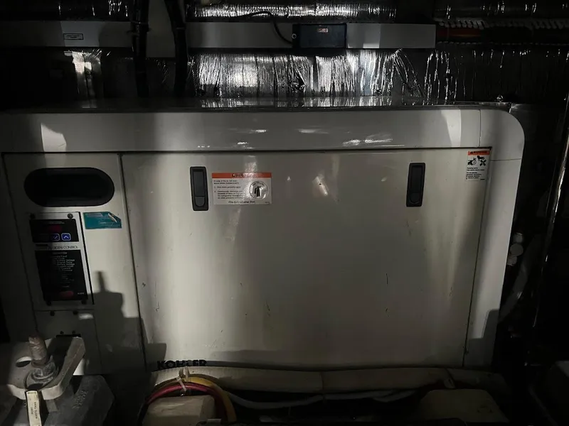 Slide: The Image of 2006 Carver Voyager engine compartment with visible wiring and components. - 45