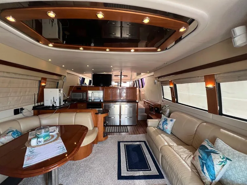 Slide: The Image of Luxurious interior of a 2006 Carver Voyager yacht with elegant seating and modern amenities. - 7