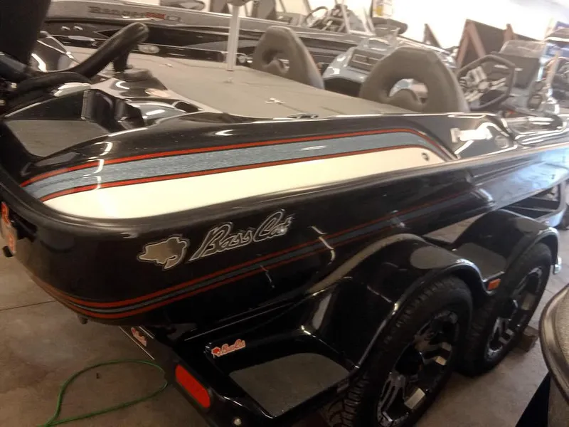 Slide: The Image of 2020 Bass Cat Puma FTD boat, black with red accents, in showroom. - 10