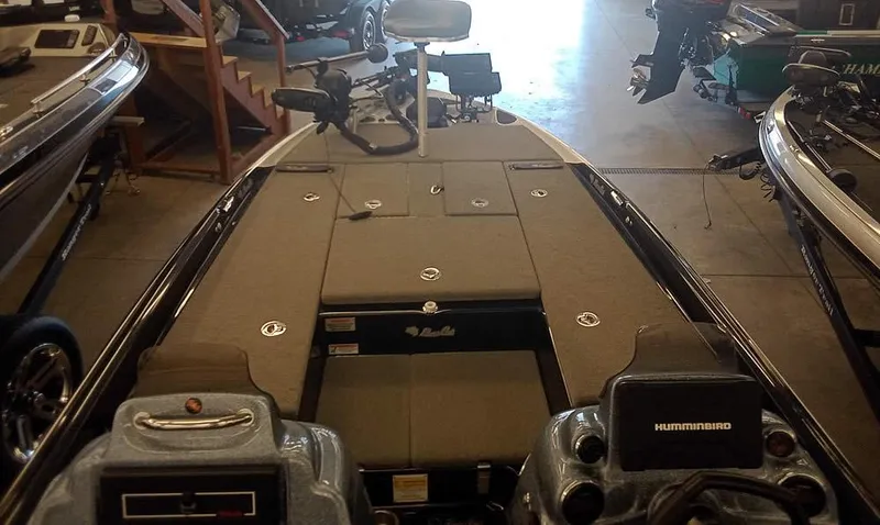 Slide: The Image of 2020 Bass Cat Puma FTD boat interior with fishing equipment and storage compartments. - 12