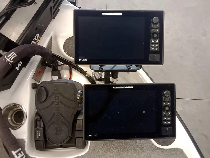 Slide: The Image of 2020 Bass Cat Puma FTD boat dashboard with dual Humminbird Solix 10 fish finders. - 14