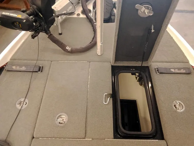 Slide: The Image of 2020 Bass Cat Puma FTD boat deck with storage compartments and trolling motor. - 15