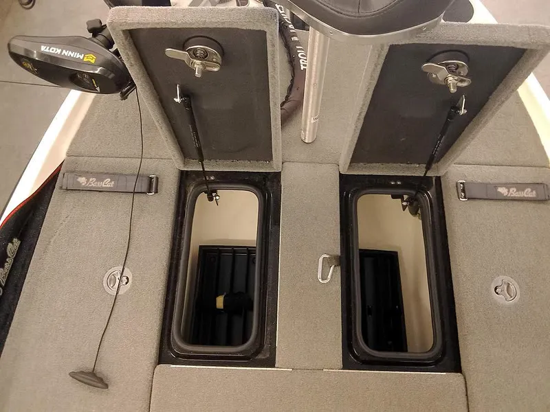 Slide: The Image of 2020 Bass Cat Puma FTD boat storage compartments with Minn Kota trolling motor. - 17