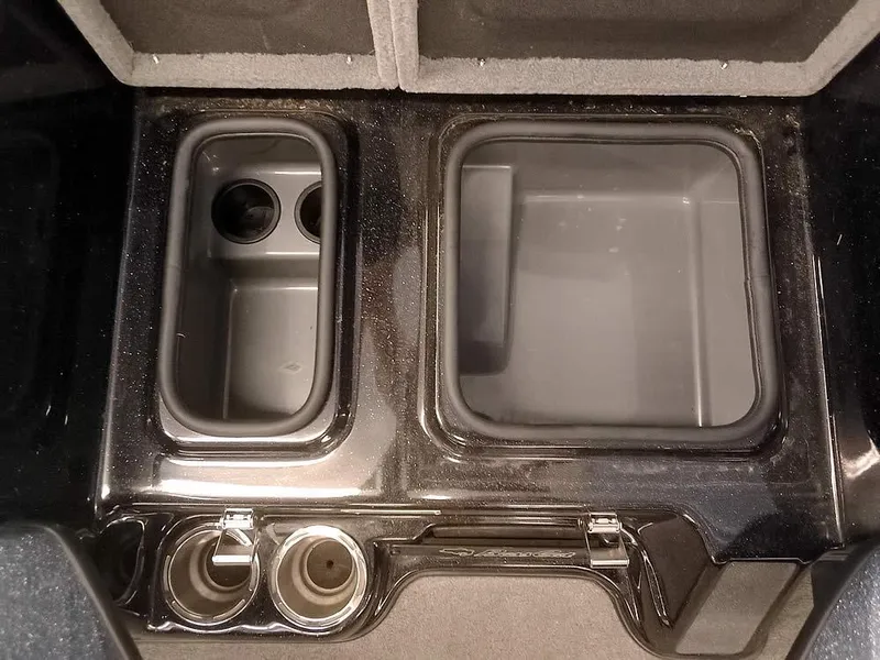 Slide: The Image of 2020 Bass Cat Puma FTD boat storage compartments and cup holders, interior view. - 19