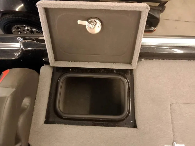 Slide: The Image of Bass Cat Puma FTD 2020 storage compartment with open lid and lock mechanism. - 27