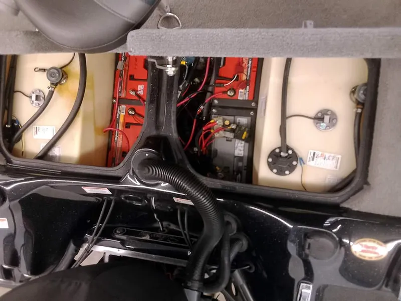 Slide: The Image of 2020 Bass Cat Puma FTD boat battery compartment with wiring and components visible. - 29
