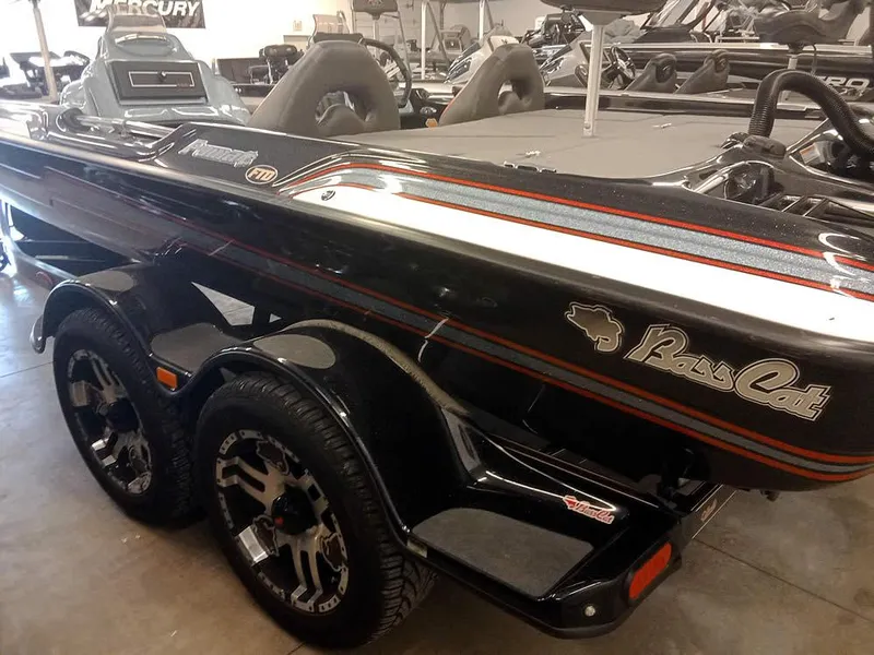 Slide: The Image of 2020 Bass Cat Puma FTD boat in showroom, black with red accents. - 4