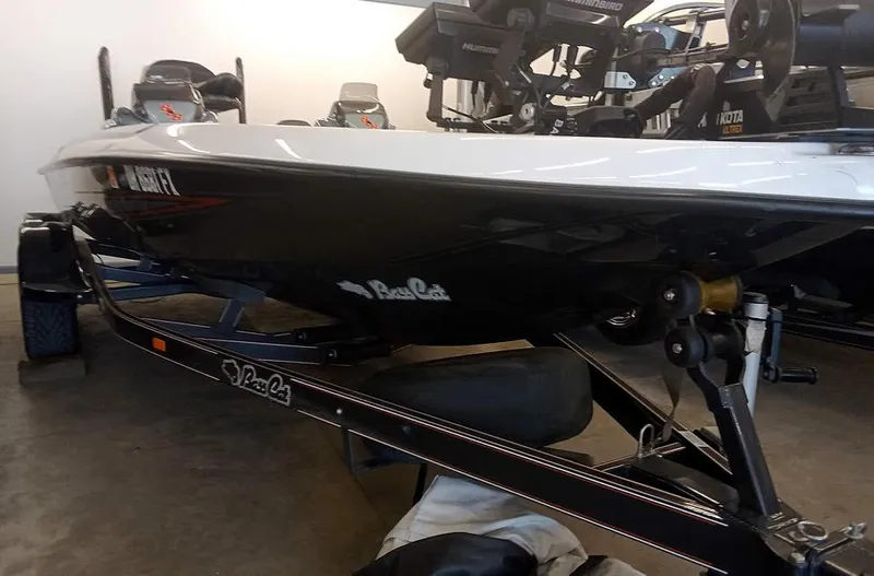 Slide: The Image of 2020 Bass Cat Puma FTD boat on trailer in garage setting. - 6