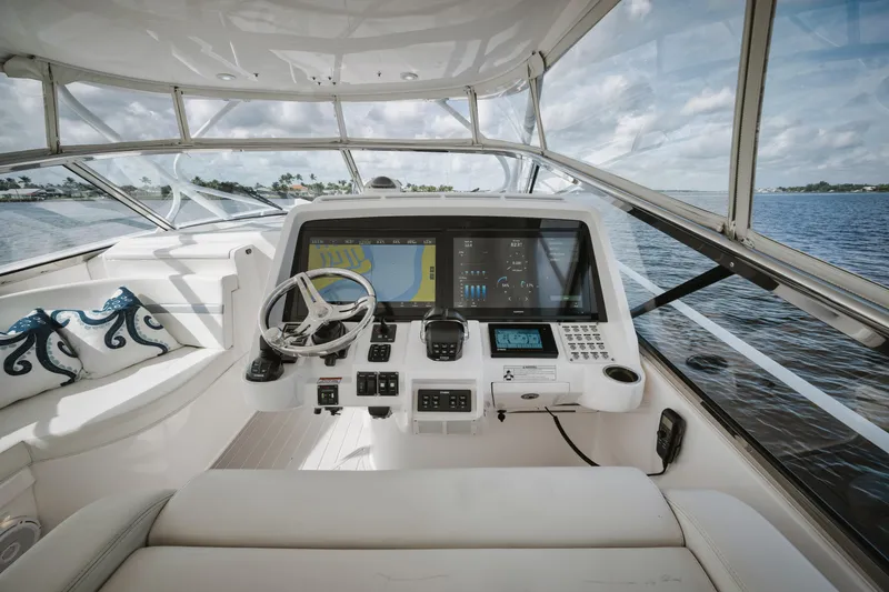 Slide: The Image of 2018 Intrepid 475 Sport Yacht helm with modern navigation system and ocean view. - 19