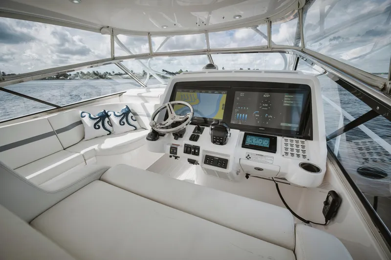 Slide: The Image of 2018 Intrepid 475 Sport Yacht cockpit with modern navigation systems and luxurious seating. - 21