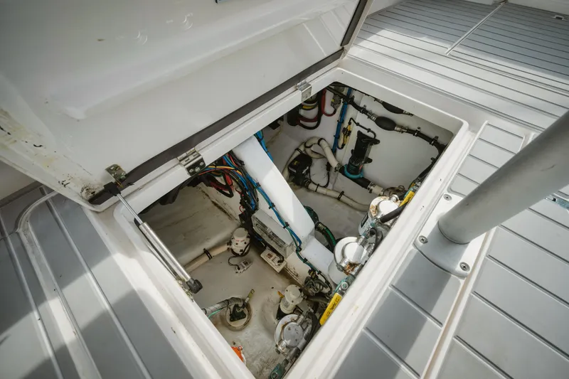 Slide: The Image of Engine compartment of 2018 Intrepid 475 Sport Yacht, showcasing mechanical components and wiring. - 32