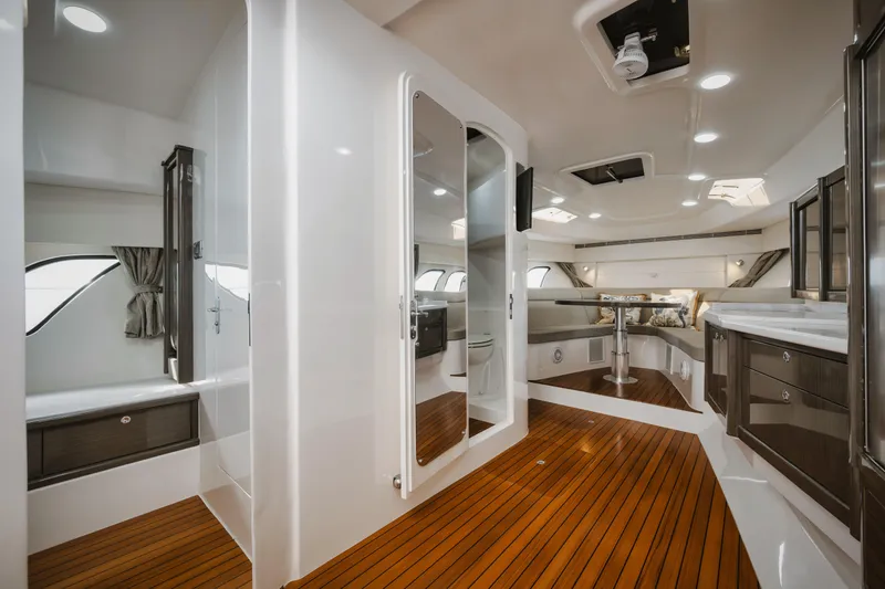 Slide: The Image of Luxurious interior of 2018 Intrepid 475 Sport Yacht with sleek design and wooden flooring. - 38
