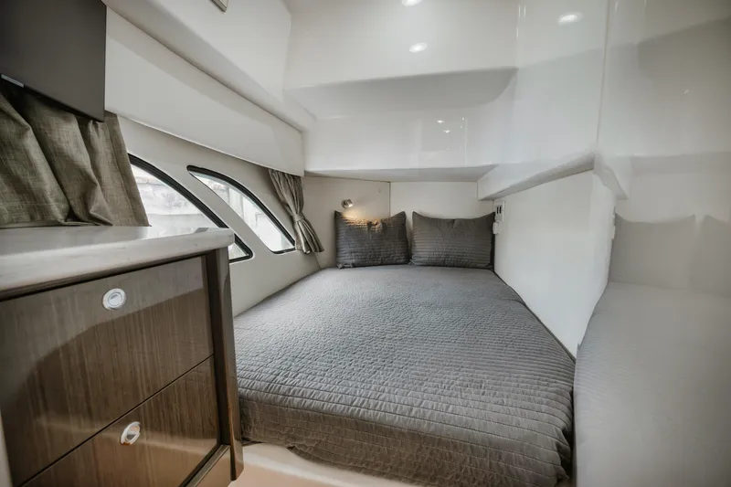 Slide: The Image of 2018 Intrepid 475 Sport Yacht cabin with cozy bed and modern interior design. - 46