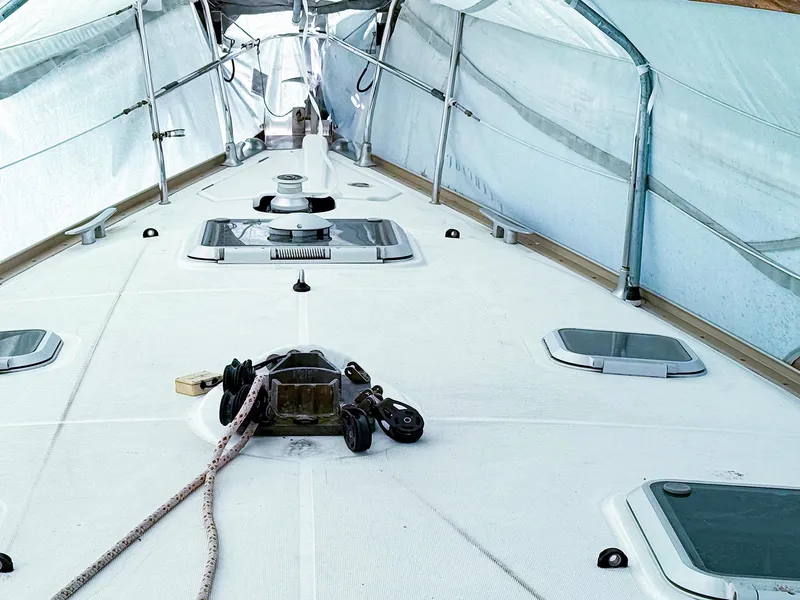 Slide: The Image of Deck of 2005 Jeanneau 40.3 sailboat under protective cover. - 2