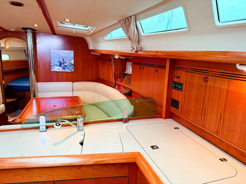 Slide: The Image of Interior of 2005 Jeanneau 40.3 sailboat with wood finish and modern amenities. - 20
