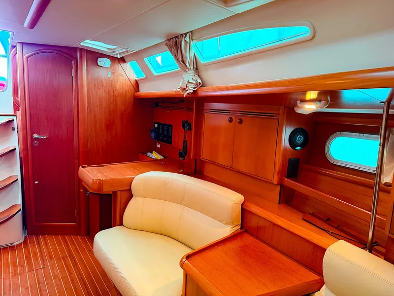Slide: The Image of Interior of 2005 Jeanneau 40.3 sailboat with wood finish and comfortable seating. - 37