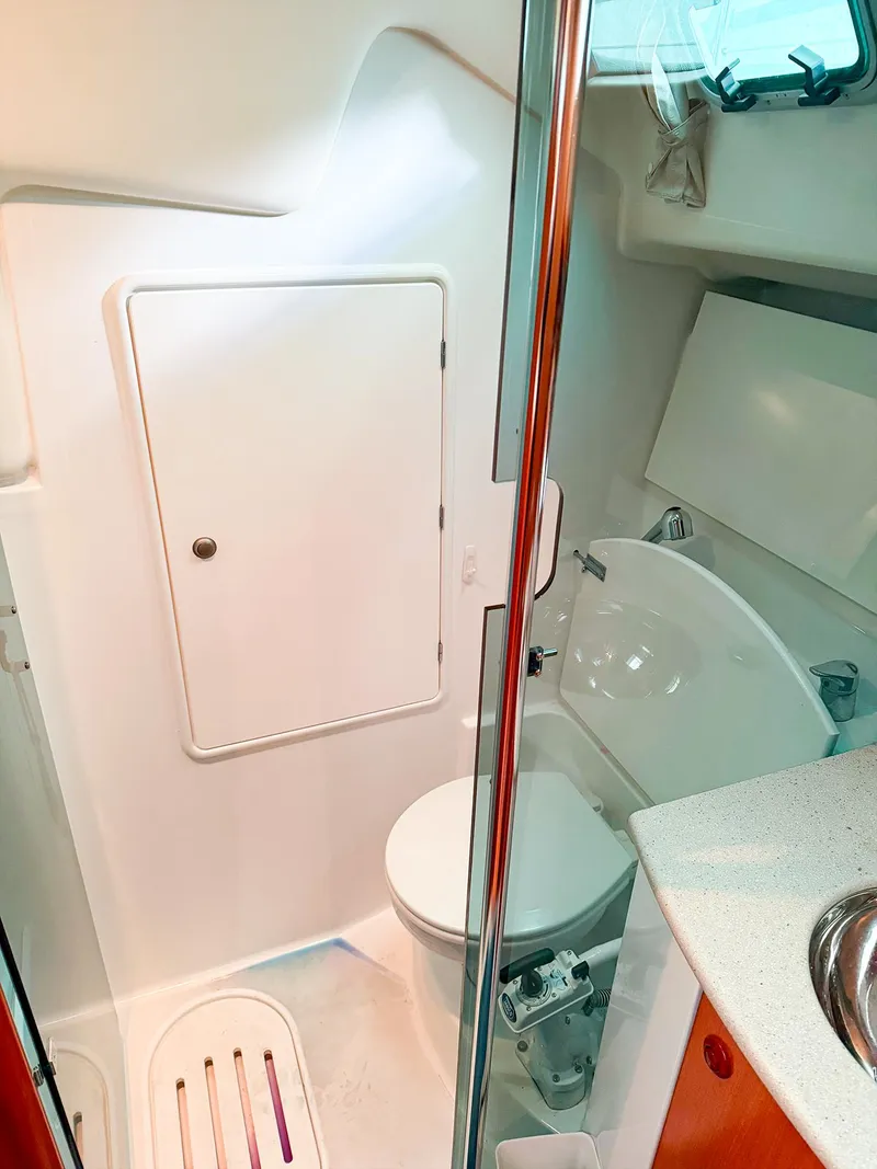 Slide: The Image of Compact bathroom in a 2005 Jeanneau 40.3 sailboat, featuring modern fixtures and efficient design. - 39
