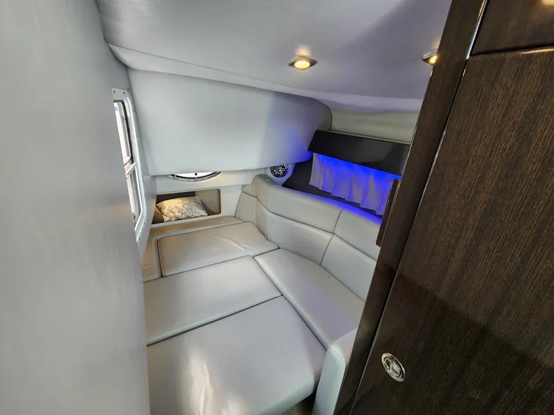 Slide: The Image of 2019 Formula 330 Crossover Bowrider OB cabin with modern seating and ambient lighting. - 11