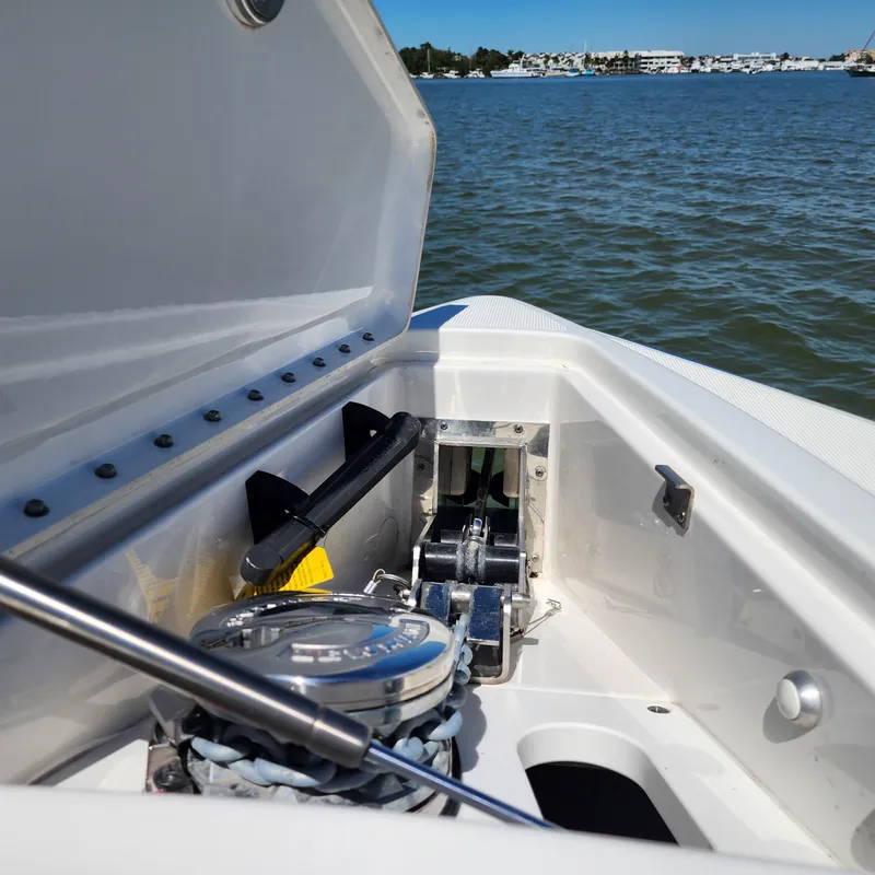 Slide: The Image of 2019 Formula 330 Crossover Bowrider OB anchor compartment with ocean view. - 32