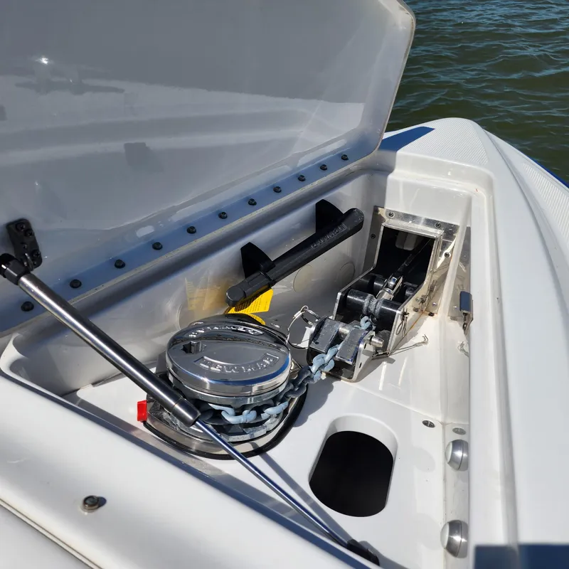 Slide: The Image of 2019 Formula 330 Crossover Bowrider OB anchor compartment with winch and storage. - 33