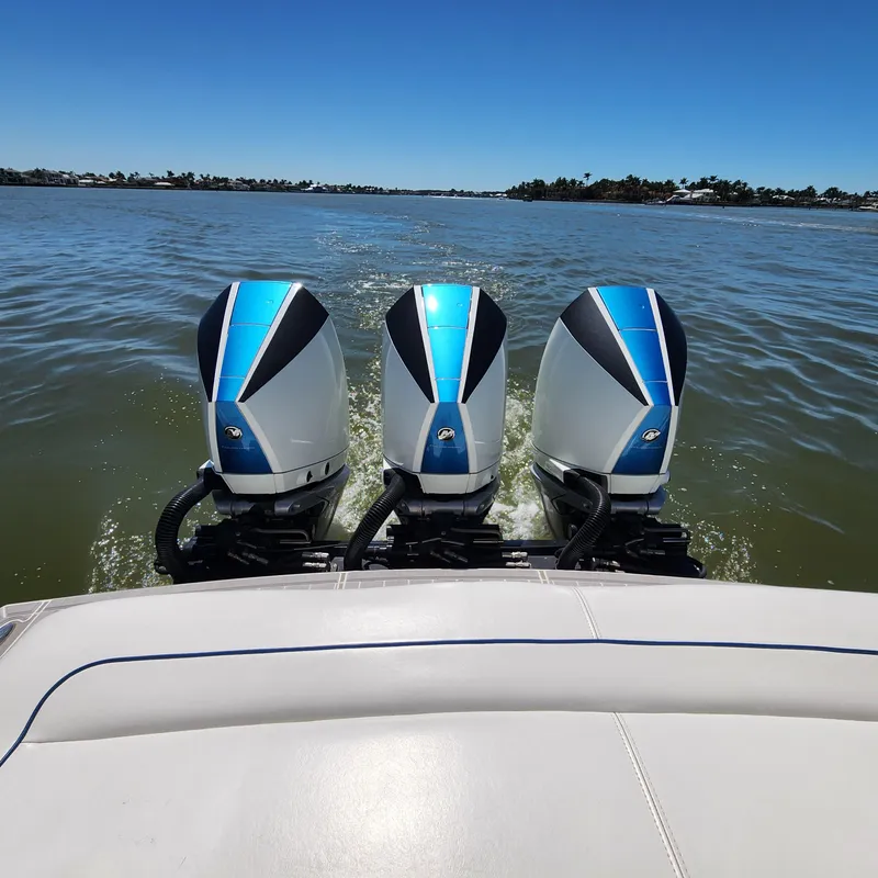 Slide: The Image of 2019 Formula 330 Crossover Bowrider OB with triple outboard engines on water. - 36