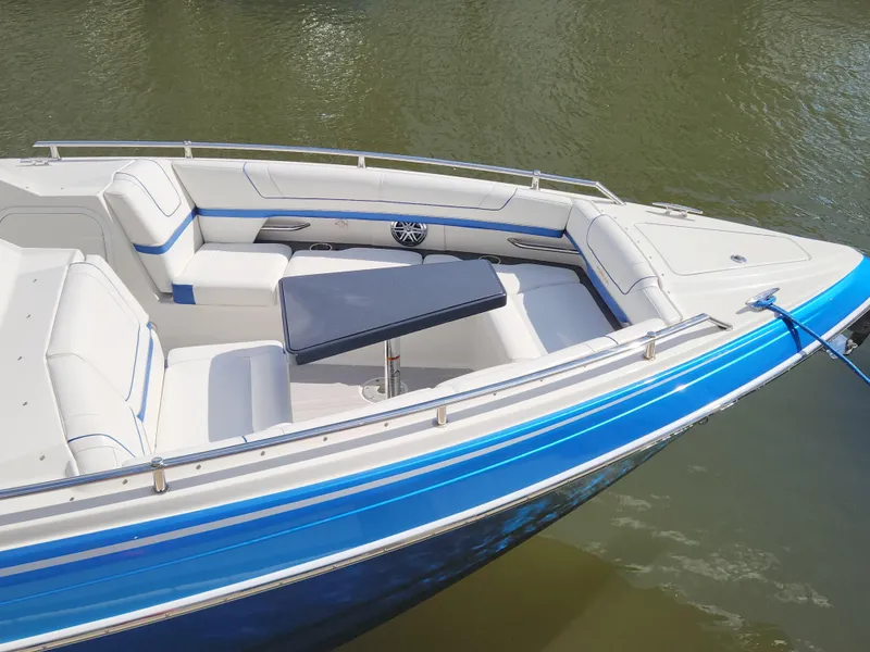 Slide: The Image of 2019 Formula 330 Crossover Bowrider OB with spacious seating and sleek design. - 4