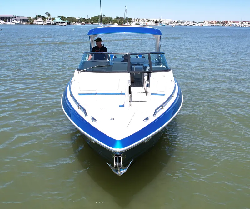 Slide: The Image of 2019 Formula 330 Crossover Bowrider OB on calm water, front view. - 40