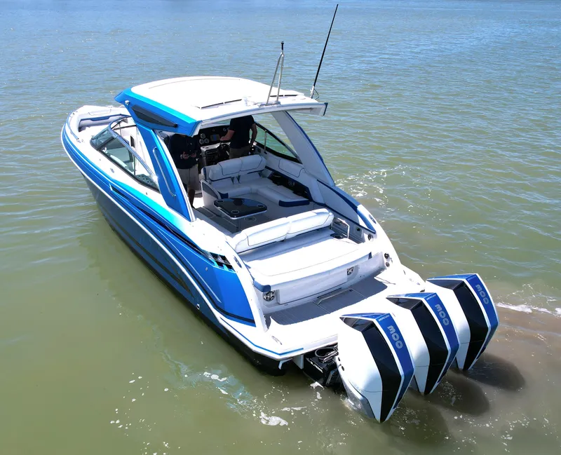 Slide: The Image of 2019 Formula 330 Crossover Bowrider OB with triple outboard engines on water. - 44